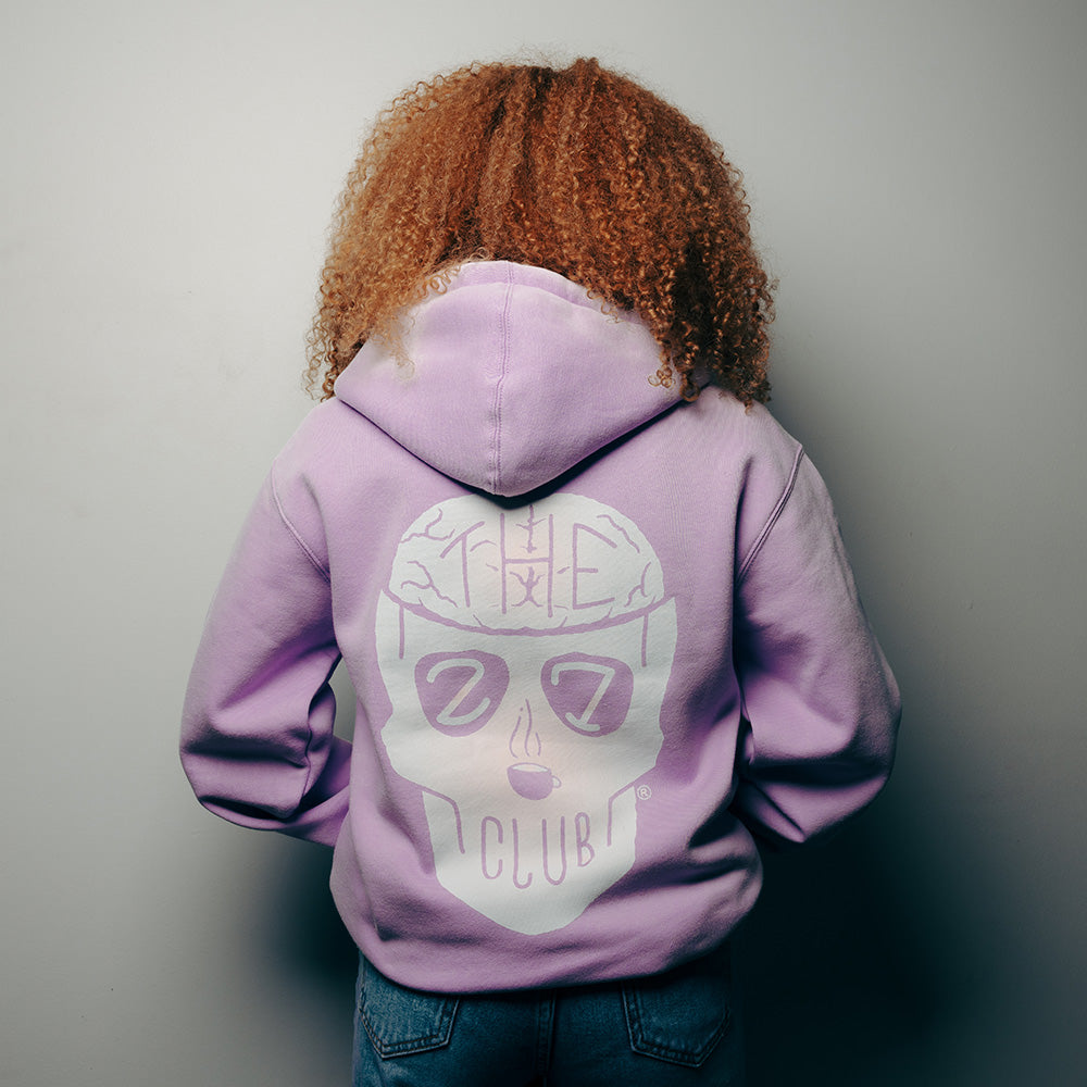 Official 27 Club Coffee Merchandise. 70% Cotton / 30% Polyester blend heavyweight lavender purple hoodie featuring the quote "Be Kind to Your Mind" and the 27 Club logo printed in pastel colored gradients.