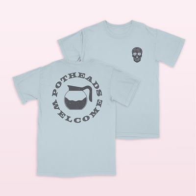 27 Club Coffee Official Merchandise • 100% Airlume combed and ring-spun cotton light blue t-shirt with 27 Club Coffee skull logo on the front and the potheads welcome design on the back. 